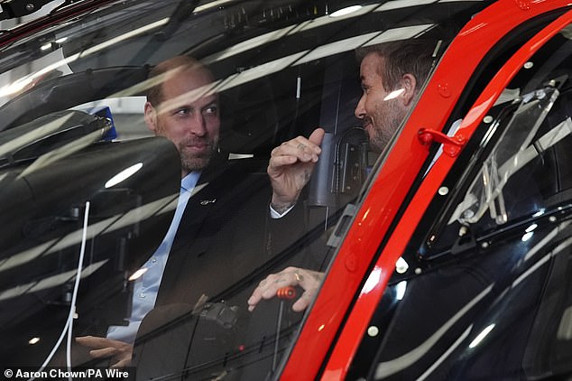 The pair appeared ready to take off as they chatted in the cockpit of the helicopter at the Northolt base