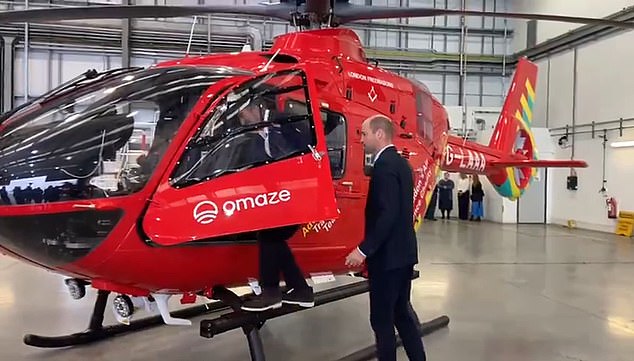 Football players first! Prince William followed David Beckham into the cockpit of a helicopter as he visited the Air Ambulance Charity this morning