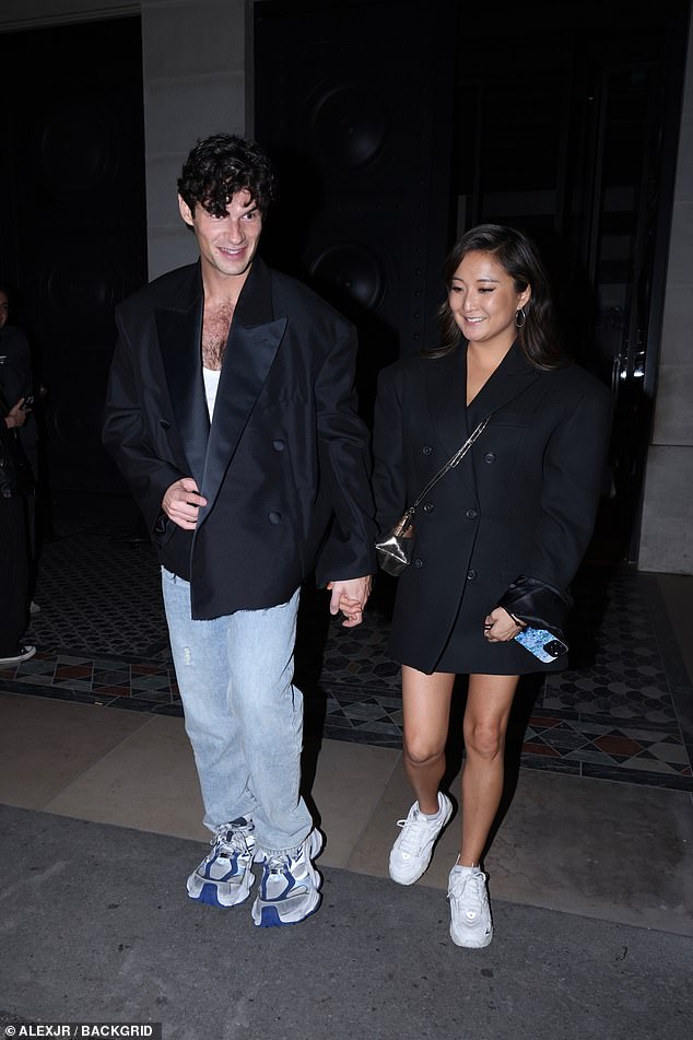 The couple wore matching black jackets and trainers as they visited the French capital during their night out