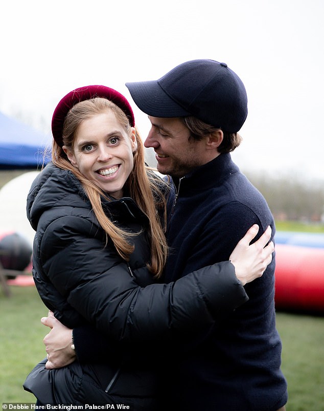 Today, a new photo was released of Princess Beatrice – wearing a black puffer jacket – smiling at the camera as she is embraced by Edoardo Mapelli Mozzi, who stares at his wife