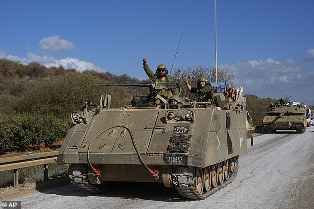 Israeli soldiers in a moving APC in northern Israel, near the Israel-Lebanon border