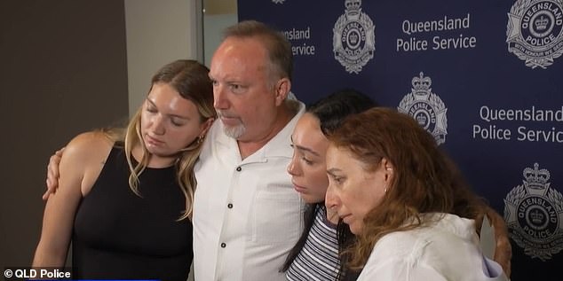 Cameron's father Chris Duce (pictured center left) paid emotional tribute to his son as he was supported by distraught loved ones