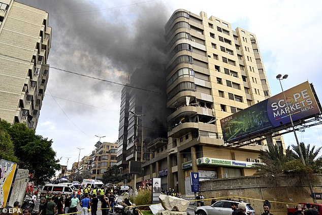 Smoke rises from a building after an Israeli military attack, in the southern suburbs of Beirut. Israel launched a ground invasion of southern Lebanon in the early hours of Tuesday