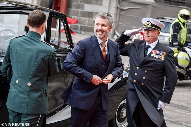 He appeared cheerful and smiling as he made his way to the seat of the Danish parliament, Christiansborg in Copenhagen