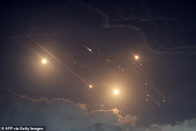 This photo shows projectiles intercepted by Israel near the northern city of Baqa al-Gharbiya on October 1, 2024. Air raid sirens sounded in central Israel on October 1, the military said, a day after the military launched ground operations in southern Lebanon targeting Hezbollah positions. “Sirens sounded in central Israel,” the army said, without giving details of the affected areas