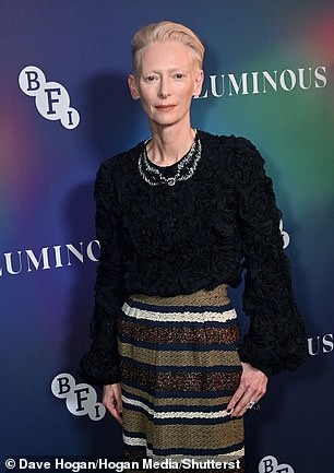 Oscar winner Tilda was equally stylish in a black ruffled top which she wore with a statement striped maxi skirt