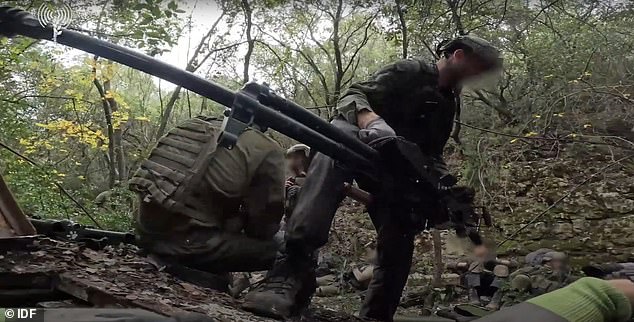 Footage captured IDF soldiers dragging Hezbollah weapons and weapons from an underground lair in Lebanon