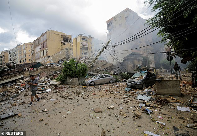 The prayer session came just hours after Israel announced it had launched a 'limited' ground invasion of Lebanon on Tuesday (photo, aftermath of Israeli attacks in Beirut)