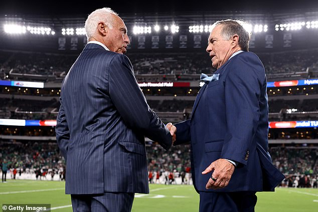 Philadelphia Eagles owner Jeffrey Lurie shakes hands with former general manager and coach Bill Belichick prior to the game at Lincoln Financial Field on September 16