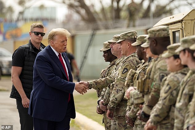 Republican presidential candidate, former President Donald Trump, greets National Guard members at the US-Mexico border, February 29, 2024,