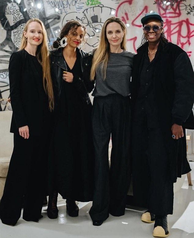 Here she is seen with several artists at an event for artist Mickalene Thomas at Atelier Jolie