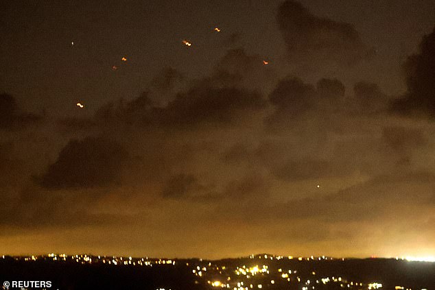 Projectiles fly in the air after Iran fires a salvo of ballistic missiles at Israel amid ongoing hostilities between Hezbollah and Israeli forces