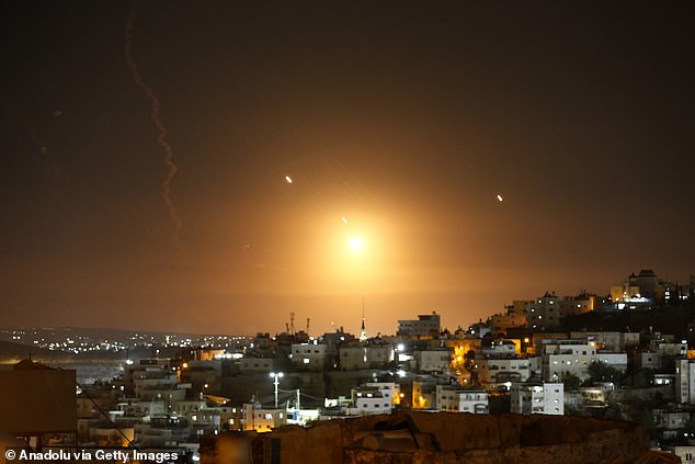 Many rockets fired from Iran are seen over Jerusalem from Hebron, West Bank