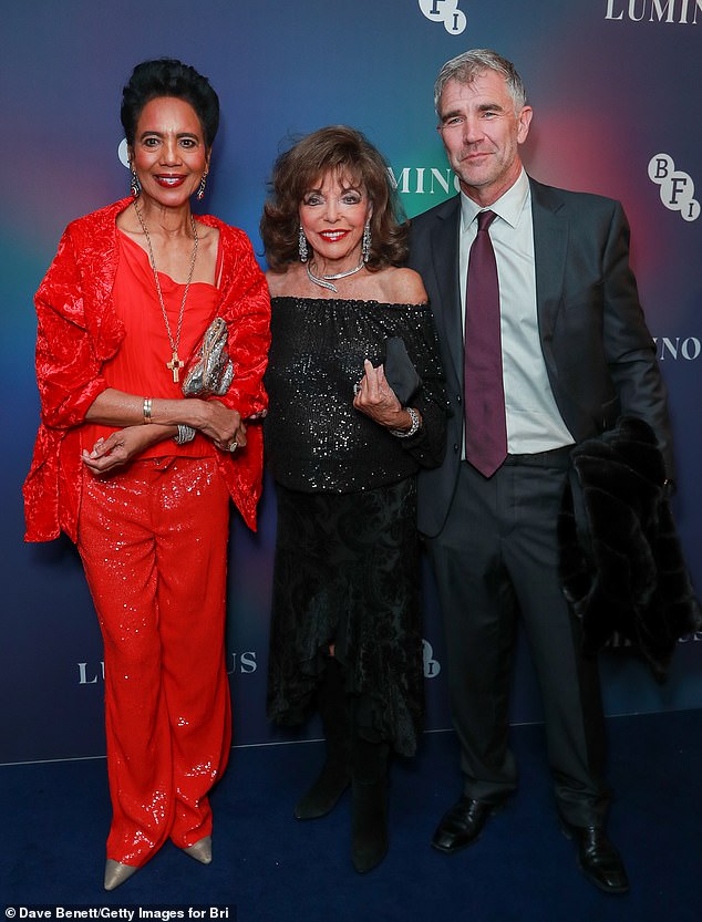 Joan made a rare outing without husband Percy Gibson, 59, and was instead joined by friends including British entrepreneur Ivan Massow (R) and sister-in-law Hazel (L)