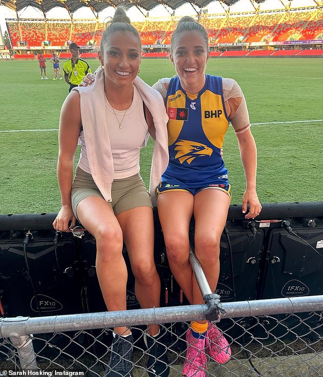 Sarah Hosking (left) is pictured with her twin sister Jess after a recent West Coast Eagles match