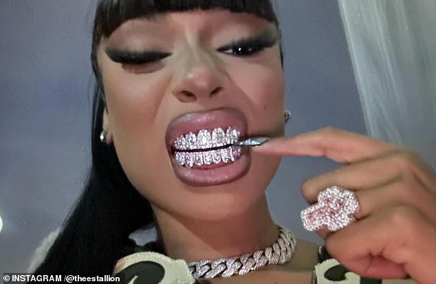 In addition to Halloween preparations, Megan showcased new sparkly grills in a post uploaded to Instagram over the weekend - and also teased an unreleased song for fans