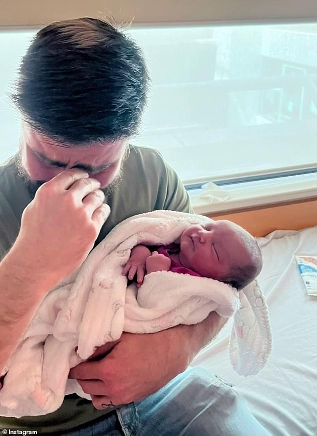 One sweet photo showed Matty overcome with emotion and wiping away tears as he held his granddaughter