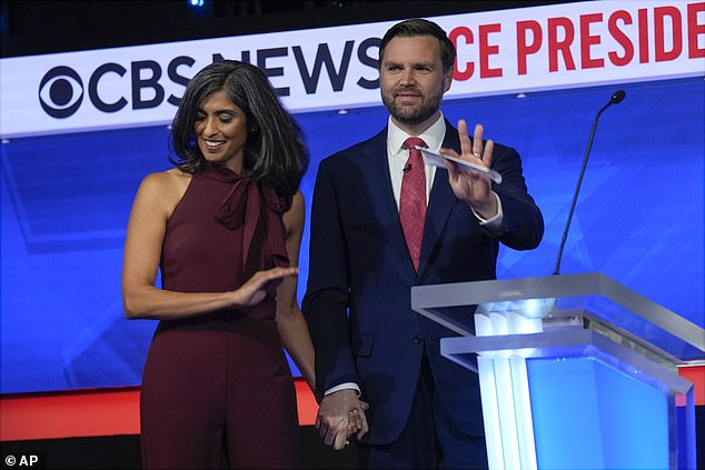 JD Vance takes his wife Usha's hand on stage after his only vice presidential debate with Tim Walz