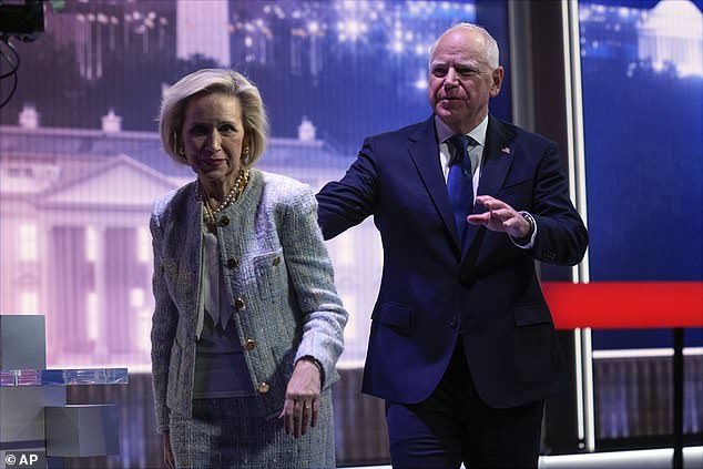 Democratic vice presidential candidate Minnesota Governor Tim Walz and his wife Gwen Walz walk off stage after a vice presidential debate