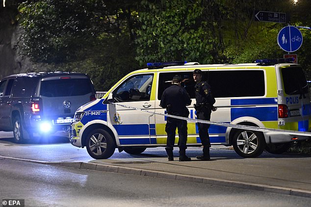 Police work outside the Israeli embassy in Stockholm, Sweden, on October 1, after a suspected shooting near the embassy