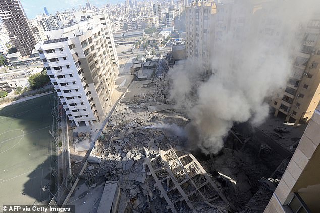 Dust and smoke rise from the site of a nighttime Israeli airstrike in Beirut's southern suburb of Shayyah on October 2, 2024. Early on October 2, at least five Israeli strikes hit Beirut's southern suburbs.