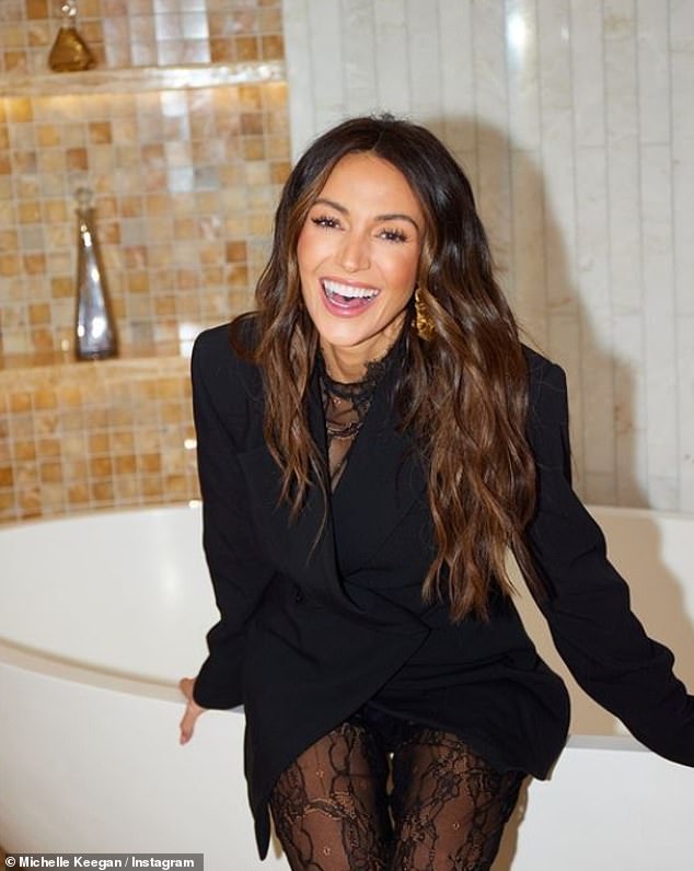 The Our Girl actress was all smiles as she showed off her new outfit while sitting on a luxurious bathtub