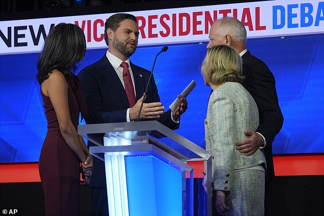 The couple exchanged pleasantries with their wives ahead of the debate