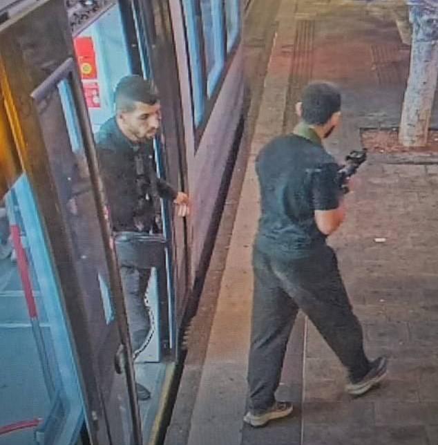 Two men with guns on the streets of Tel Aviv during last night's attack