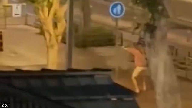 Incredible footage shows him running after them in his sandals as he fires, forcing the other to flee