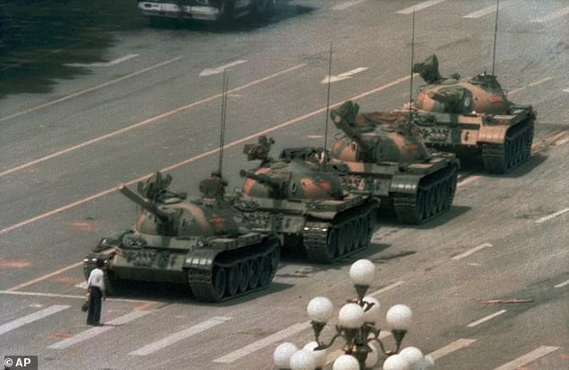 In this June 5, 1989 file photo, a Chinese man stands alone to block a line of tanks heading east on Beijing's Changan Boulevard. in Tiananmen Square.