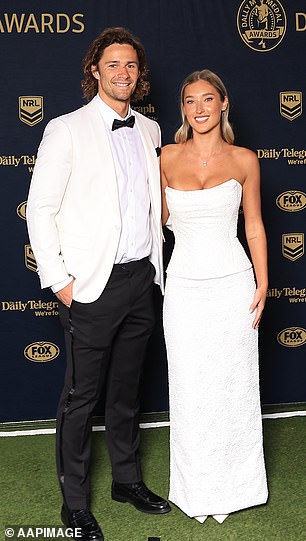 Piper Wallis joined the Sharks' Nicho Hynes in a simple white strapless dress with slingback heels. Although the look didn't turn heads, it was a chic and tasteful choice