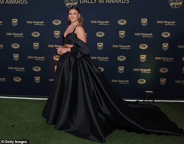 The Roosters' Millie Elliott walked the carpet in a stunning black ball gown and made sure she stood out from the crowd due to her sheer size