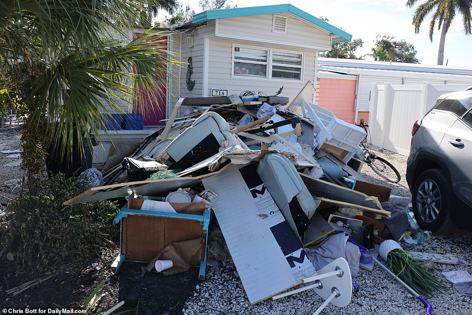 Outside, debris and rubble from homes hit by the hurricane piled up