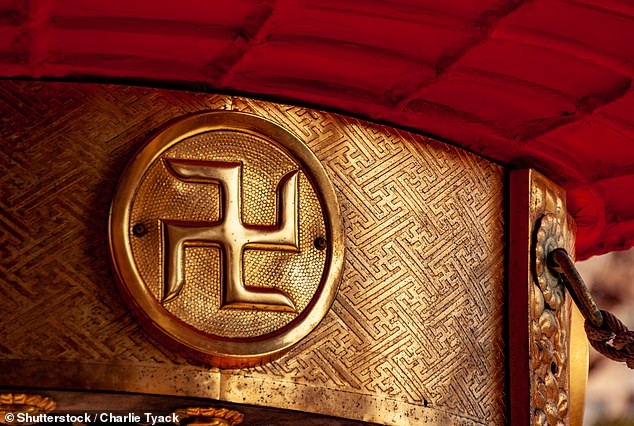 A close-up of a swastika at the Asakusa Shrine in Tokyo, it has been used to mark temples for centuries