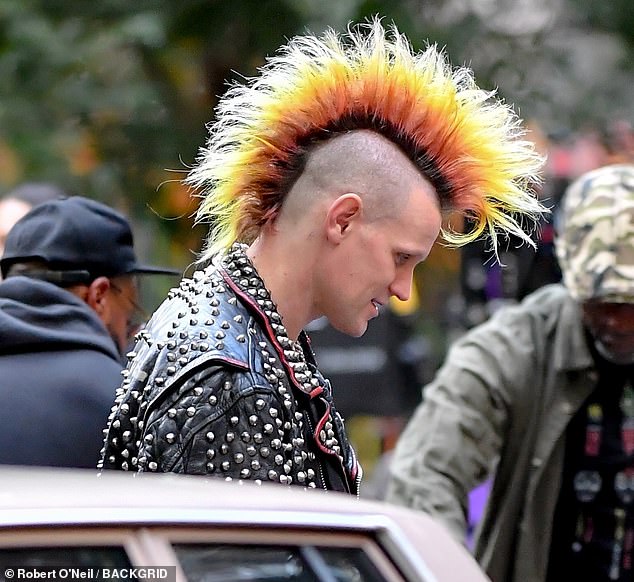 Smith was hard to miss thanks to his massive Mohican as he relaxed between takes