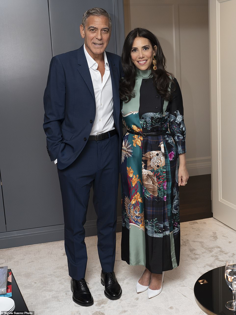 Clooney poses with Tahari, who wore a multi-print satin dress and white pumps