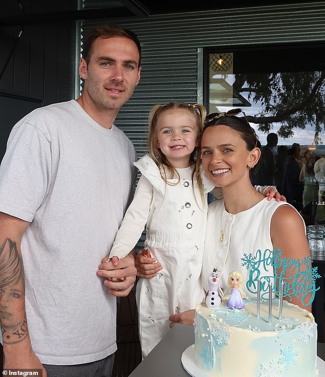 The mother-of-one, who is battling stage 4 bowel and lung cancer, bravely told listeners she did not want her life to be 'defined by her disease'. Pictured with husband, Port Adelaide star Jeremy Finlayson, and their daughter