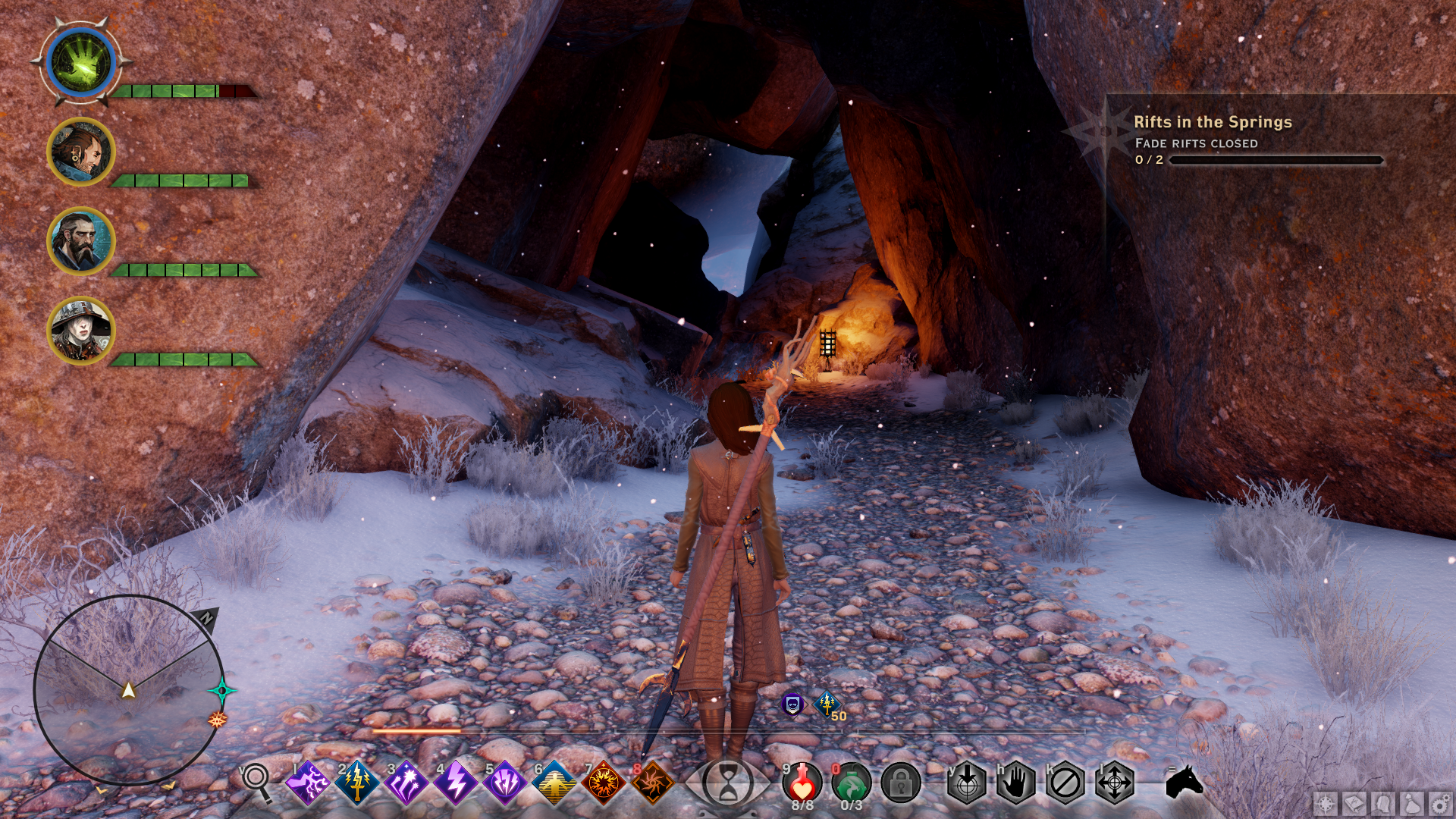 A character from Dragon Age: Inquisiton standing in front of a rocky mountain formation