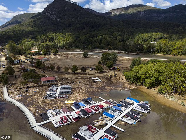 In this drone image, a marina is choked with debris in the aftermath of Hurricane Helene, Wednesday, Oct. 2, 2024, in Lake Lure