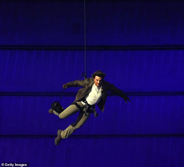 Dad Cruise storms into the stadium during the closing ceremony of the Paris 2024 Olympic Games at Stade de France on August 11