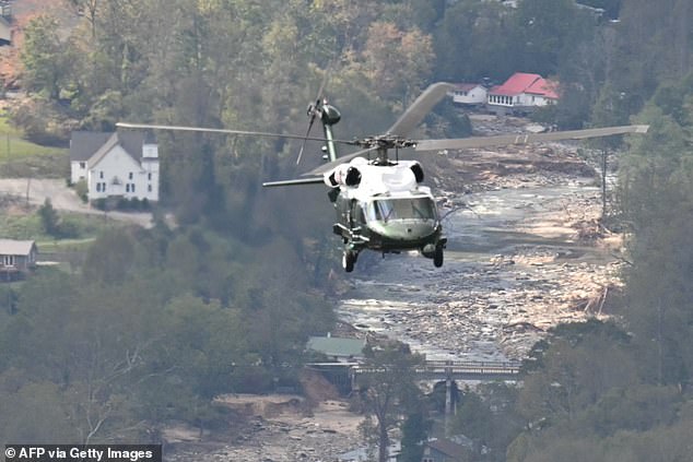 Marine One, carrying US President Joe Biden, flies over a storm-hit area near Asheville, North Carolina on October 2, 2024