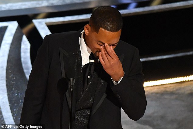 An emotional Smith fought back tears as he accepted his Best Actor Oscar for King Richard