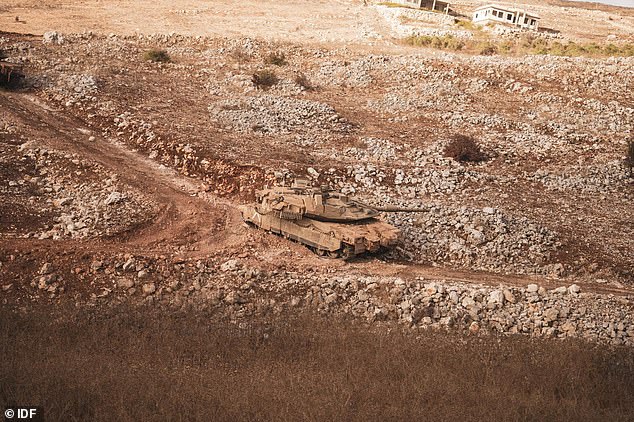 An Israeli tank is seen entering southern Lebanon