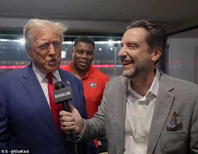 Trump, Herschel Walker (center) and Clay Travis are pictured during Georgia-Alabama