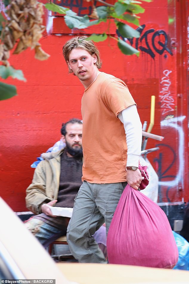 He carried a large red bag filled with his character's belongings