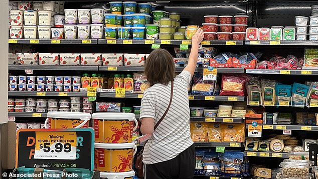 A customer views refrigerated items at a Grocery Outlet store in Pleasanton, California.