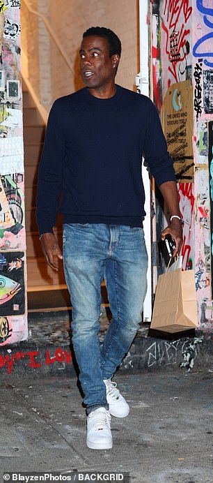 Meanwhile, comedian Chris Rock, 59, wore a navy blue sweater with blue jeans for the occasion