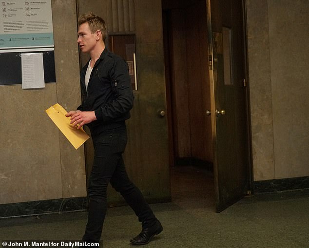 Gruber pictured leaving court in Manhattan after an unrelated arrest in 2019, where he was accused of attacking someone with a frying pan