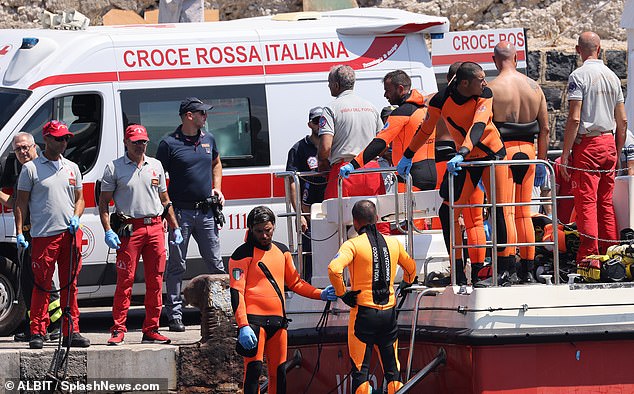 Rescuers stand by after recovering Hannah Lynch's body off the coast of Porticello