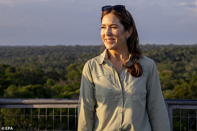 She is in the country for a four-day official visit. Pictured at the top of a 42 meter high observation tower overlooking the Amazon rainforest